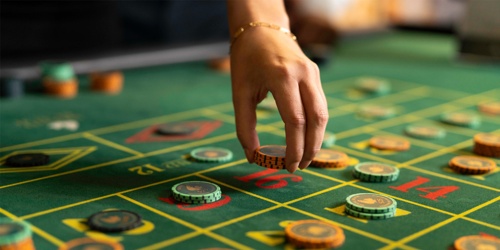 Chips being placed down by a hand