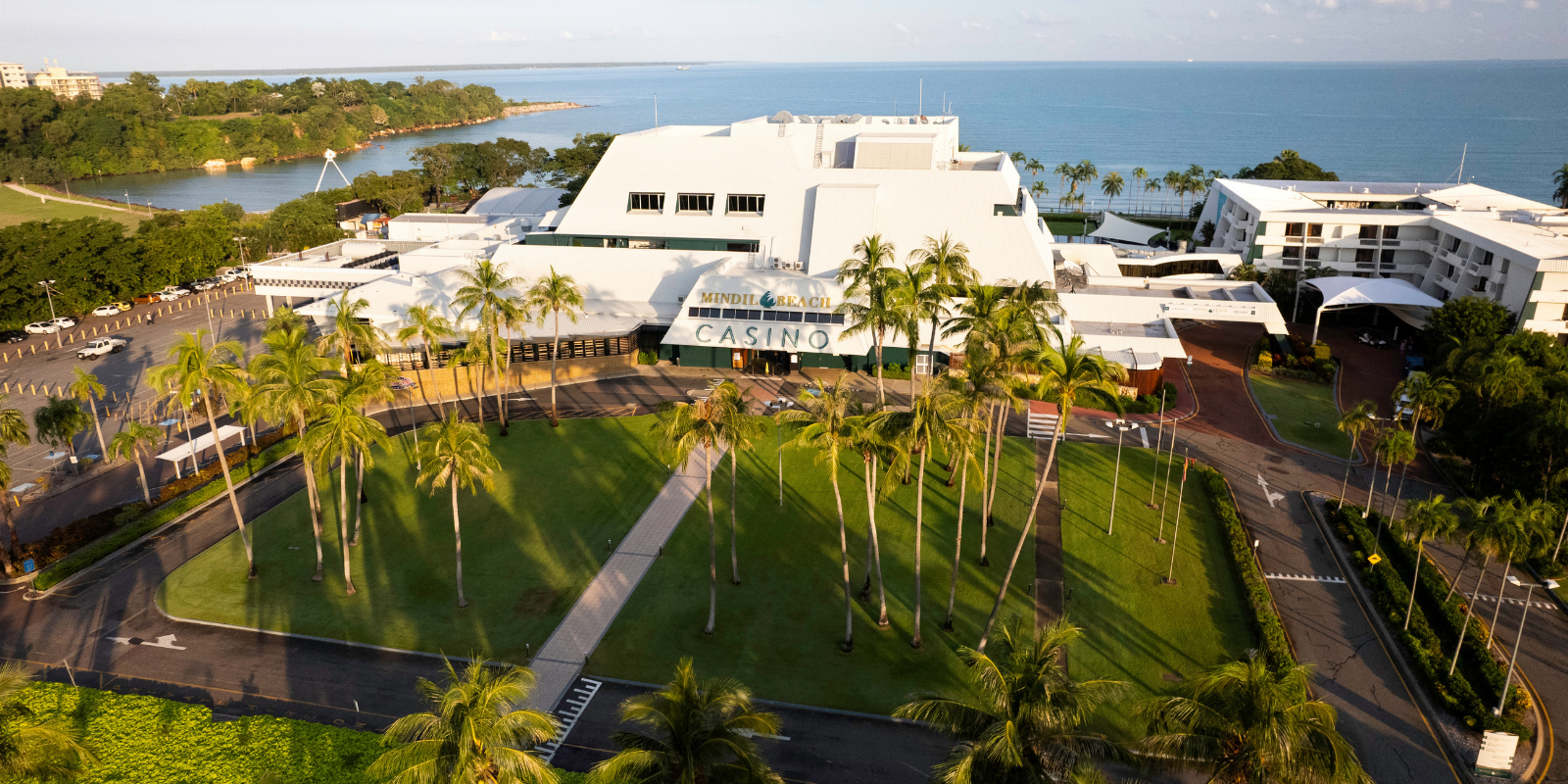View of the resort pool featuring palm trees.